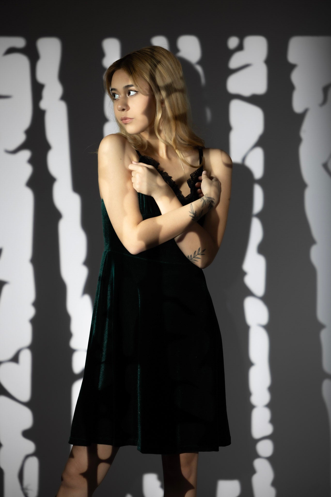 Woman wearing a gothic velvet slip dress with lace detailing by Olivia Noire Fashion